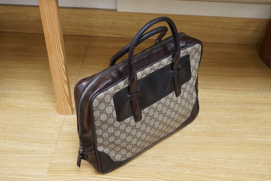 A Gucci supreme monogram travel case, 40cm wide